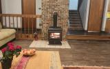 The powerful wood stove can heat the entire house