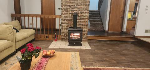 The powerful wood stove can heat the entire house