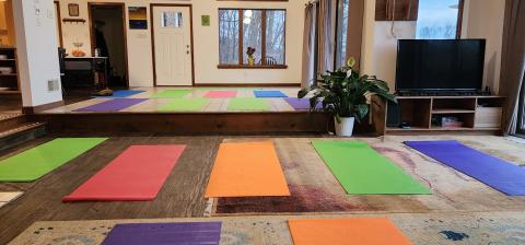 The living room and dining area can become a yoga studio for 25-30 people